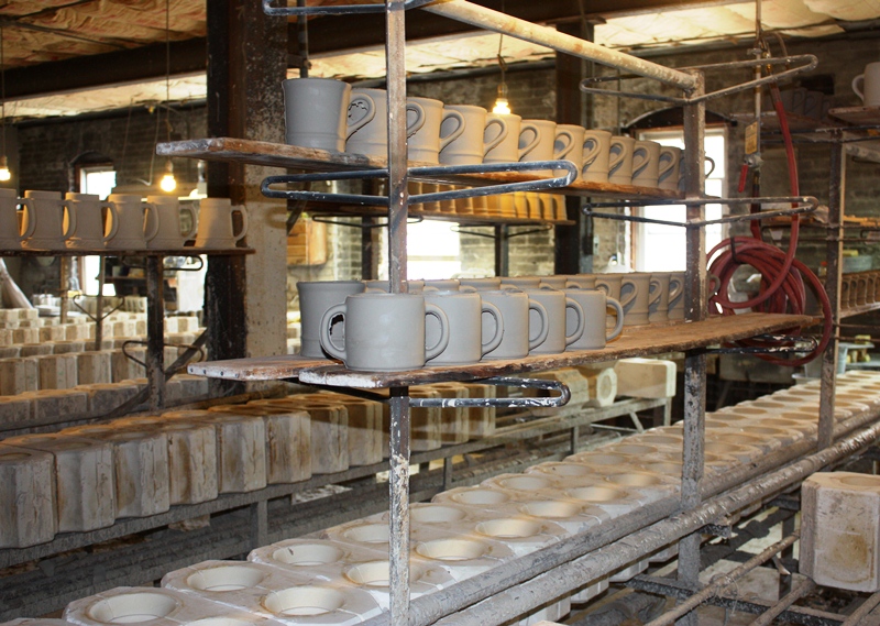 American Mug & Stein makes each mug by hand, a process that is overshadowed by Japan and China's cutting-edge technology American Mug & Stein makes each mug by hand, a process that is overshadowed by Japan and China's cutting-edge technology
