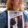 One young woman holds a sign showing her anger over Governor Ted Strickland's budget proposal for libraries