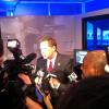Governor John Kasich answers reporters' as he leaves the conference area after making the Diebold announcement. 