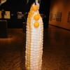 Three shoulder high glass and brass ears of corn are the work of Michael Meilhahn.