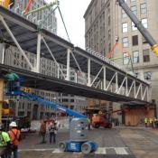 After closing the intersection on Friday afternoon, crews worked all weekend to hoist the Horseshoe Cleveland's 16.5 ft. walkway over the Ontario Street and Prospect Avenue intersection in downtown Cleveland. The intersection is expected to open by 6 a.m. today