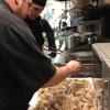 Chef Josh Schory of Lucca sprinkles porcini mushroom ash on fried pork rinds.
