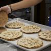Lakmajoons are like a pizza sandwich. The meat is partially cooked before it's spread on the crust and then baked.