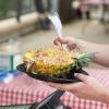 The TeriAkron bowl is a hollowed-out pineapple half stuffed with diced white meat chicken, white rice and teriyaki sauce.
