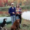 Paul and Diana Feezel relax on their farm with their dogs. The boom has paid off financially for them and their neighbors but they wonder: at what cost?