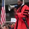 Pastor Jawanza Colvin of of the Olivet Instructional Baptist Church call for reforms outside the Cuyahoga County Justice Center.