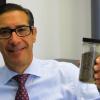 Port Authority President William Friedman with a jar of dredged and dried sediment