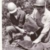 Bill Hlavin, left, examines a plant fossil found during the I-71 dig. Hlavin regrets that many rare plant fossils were left behind as his crews focused on recovering Devonian era fish specimens.